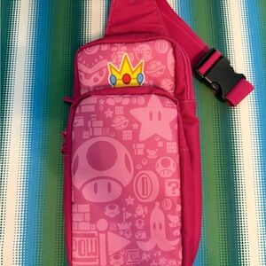 Pink Sling Bag with Game Icon Print. Nintendo switch